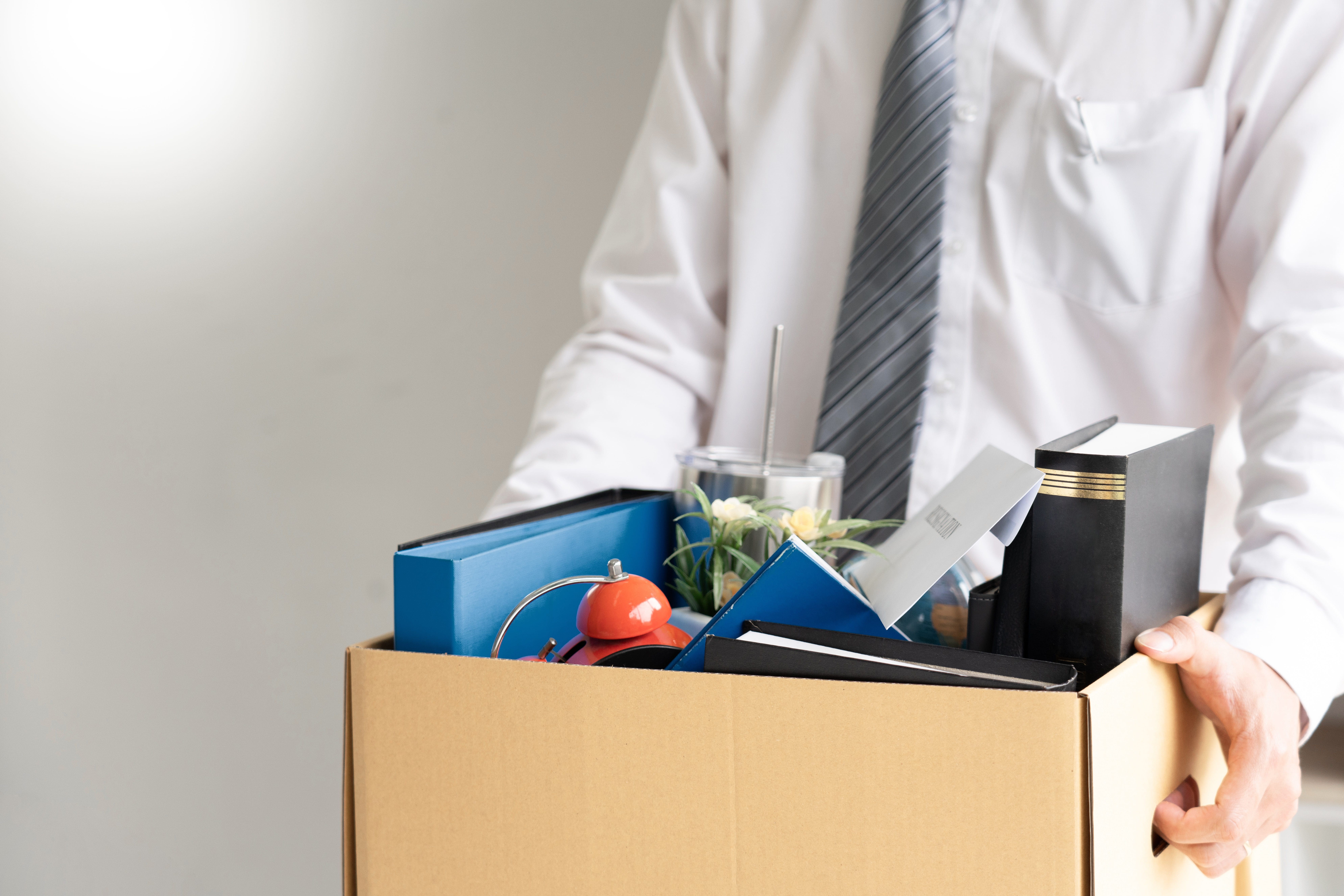 Businessman,Has,A,Brown,Cardboard,Box,And,Resignation,Letter,Write